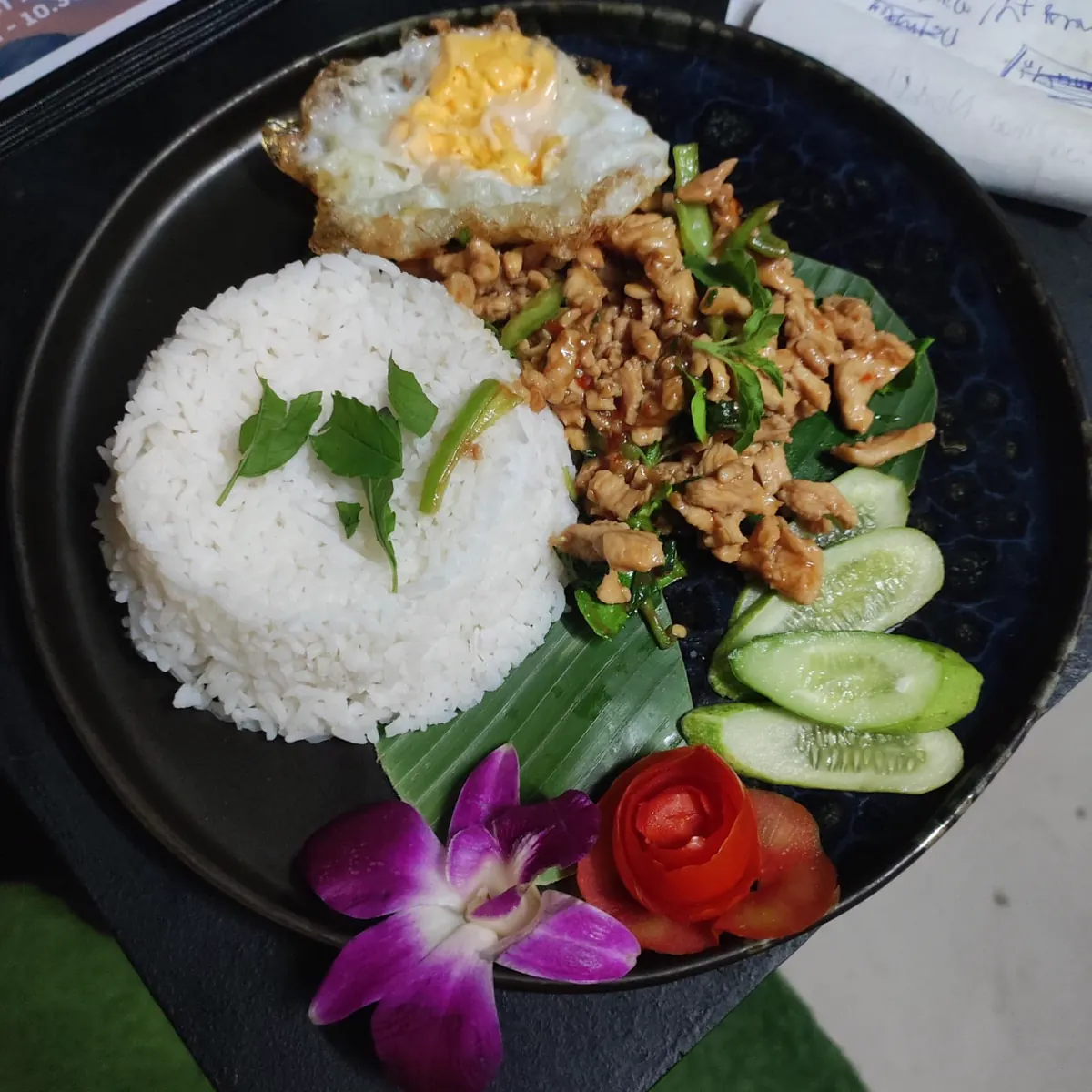Pad Kra Pao: stir-fried chicken with holy basil, jasmine rice and a fried egg